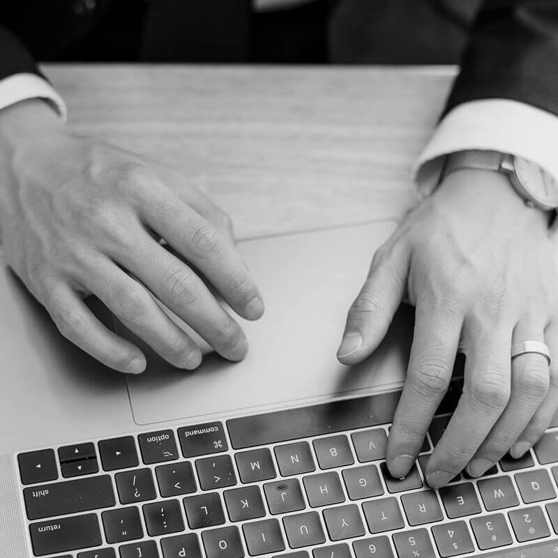 Clickatoo-AI-Powered Digital Marketing and SEO Agency- image of a male's hands working on laptop